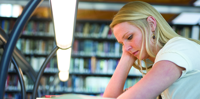 A student studies in the Law Library.